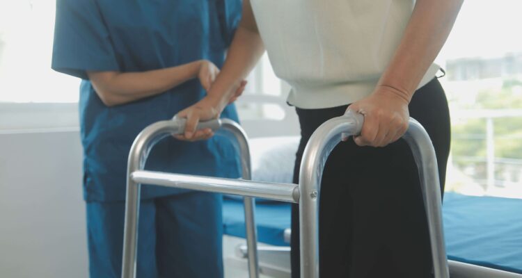 Female Using A Walker With Doctor Occupational Therapy